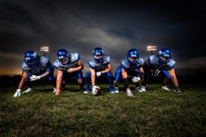 youth football team in position with blue jerseys