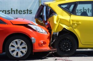 rear-end crash test with red and yellow cars