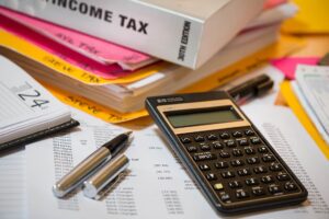 income tax return papers and calculator
