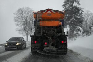 large snowplow clearing snowy roadway