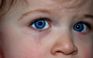 blue-eyed child crying
