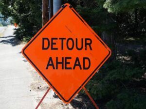 orange detour road construction sign