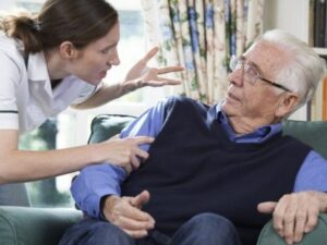 female nurse verbally abusing male nursing home patient