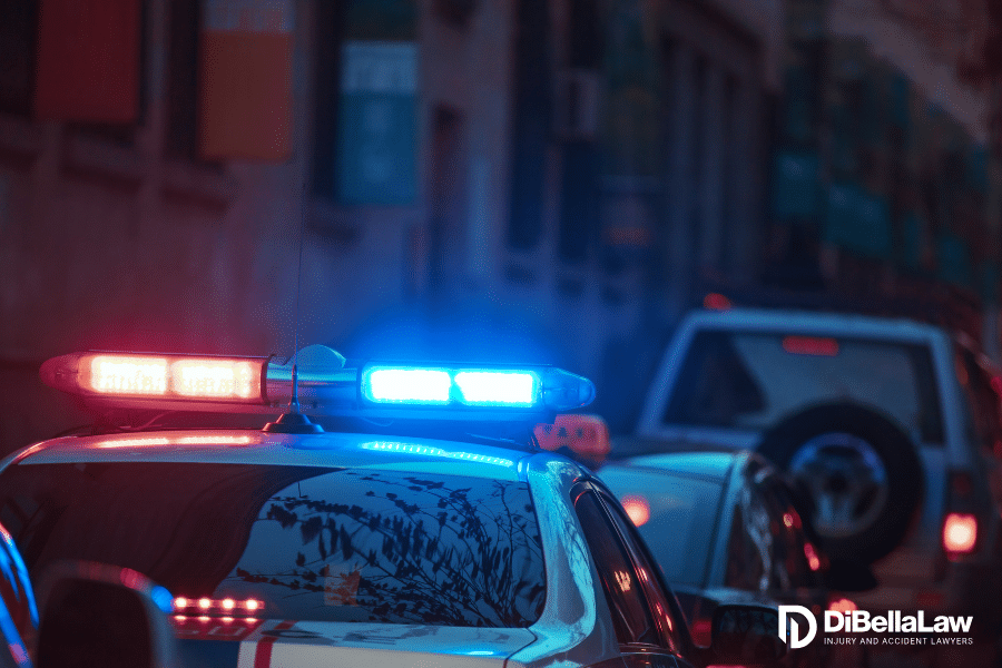 Police car involved in an accident in Boston, MA with it's lights on