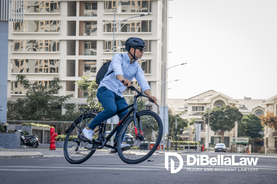 Man wearing a helmet riding his bicycle in Boston, Massachusetts