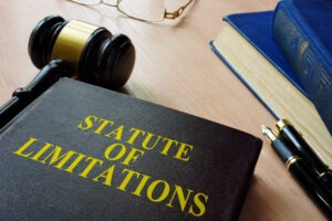 A folder labeled statute of limitations sits next to a gavel.