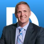 Chris Dibella behind a Blue Background