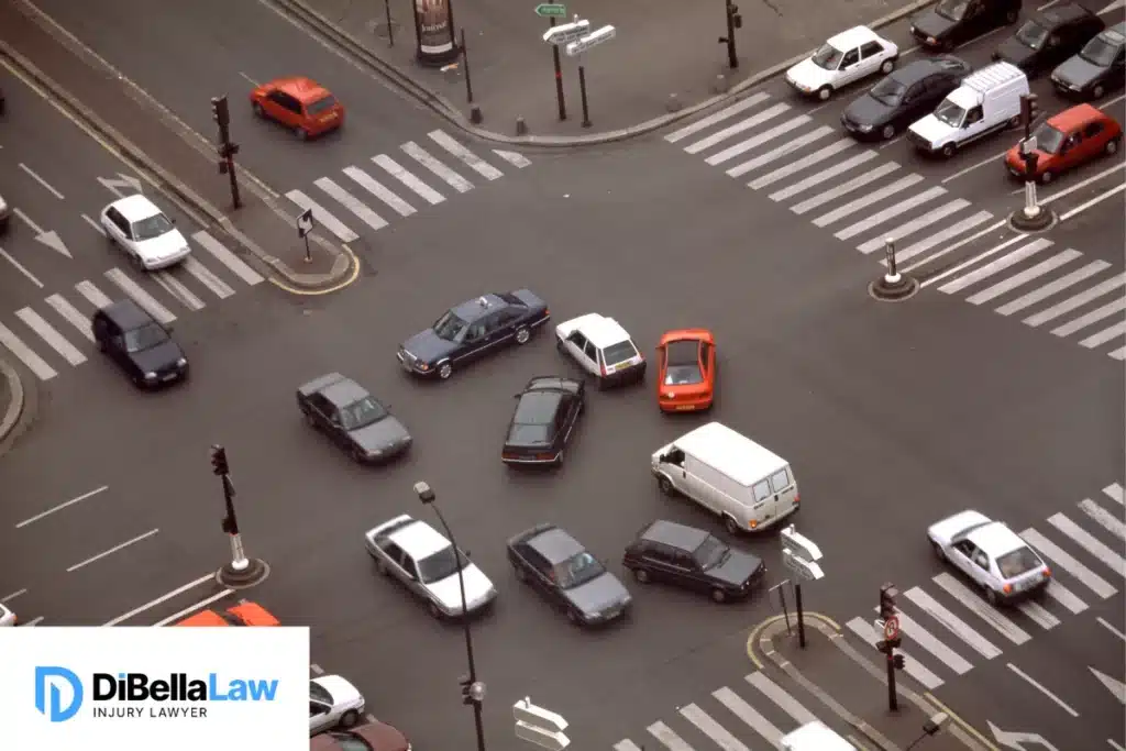 Multiple car accidents at a busy intersection.