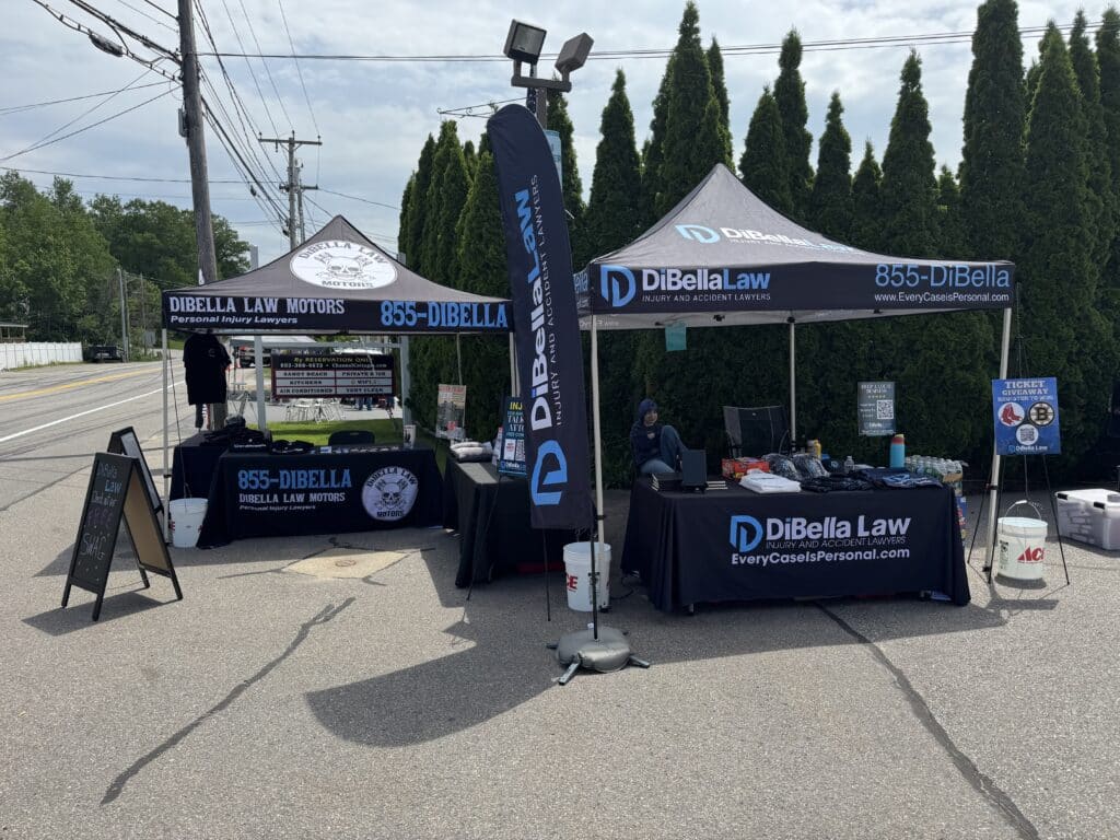DiBella Law Motors' booth at Laconia Bike Week event where they handed out swag and offered free consultations for motorcycle riders