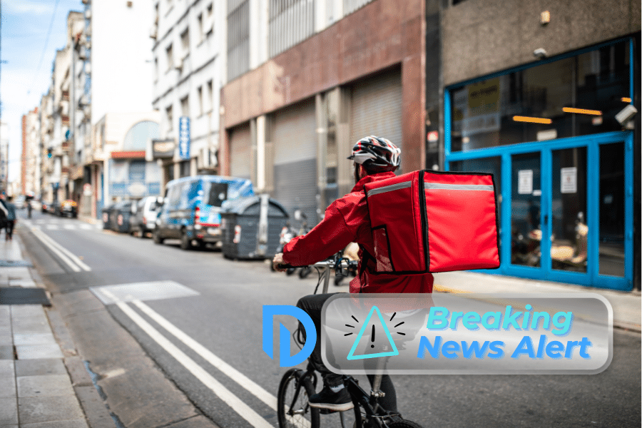 food delivery workers on an e-bike in Boston