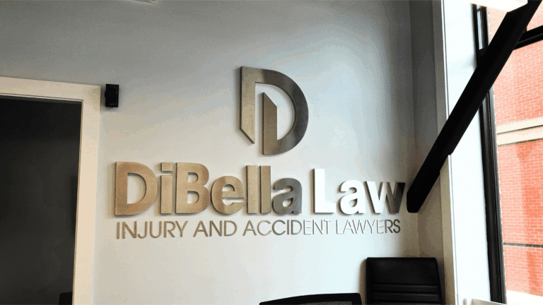 DiBella Law Injury & Accident Lawyers logo signage inside the Boston office