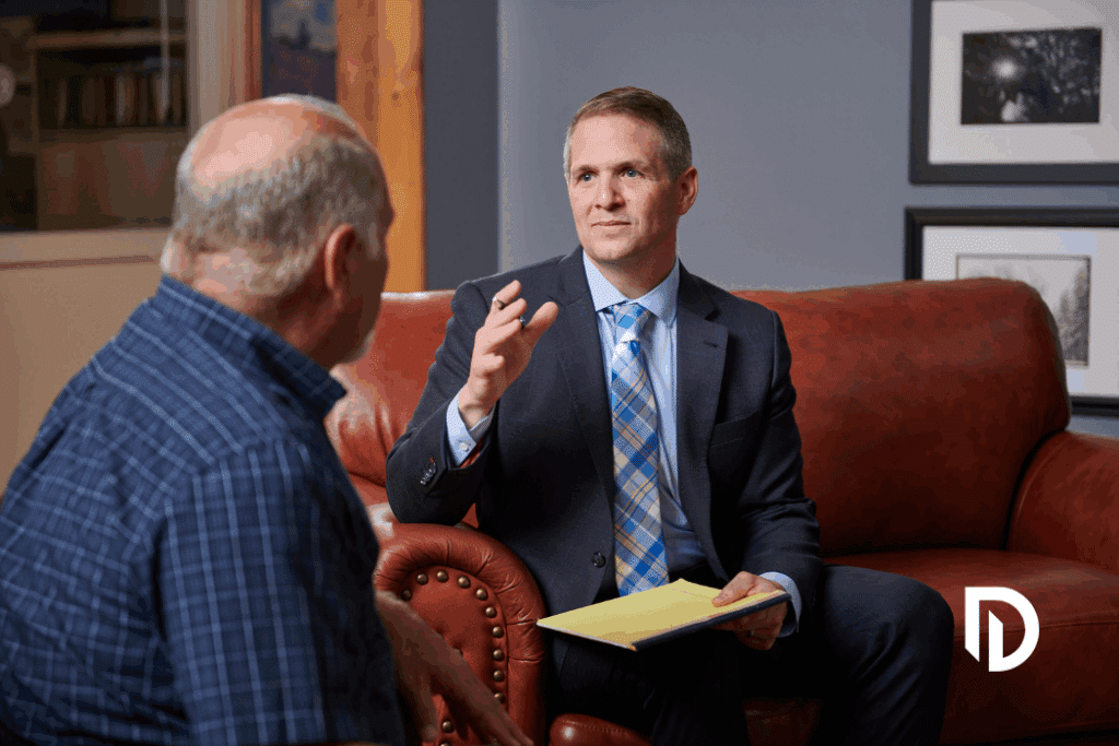 Attorney Chris DiBella dicussing personal injury law with a client