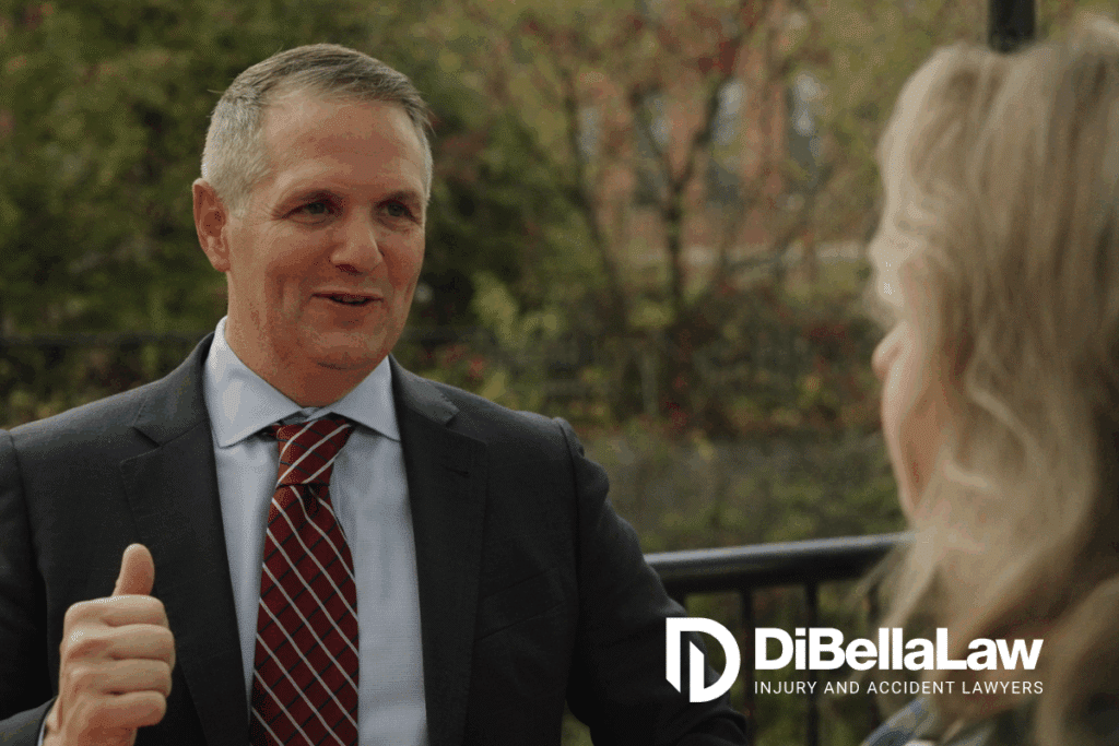 Chris DiBella talking with a client outside
