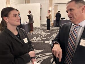 Chris DiBella speaking with young law student