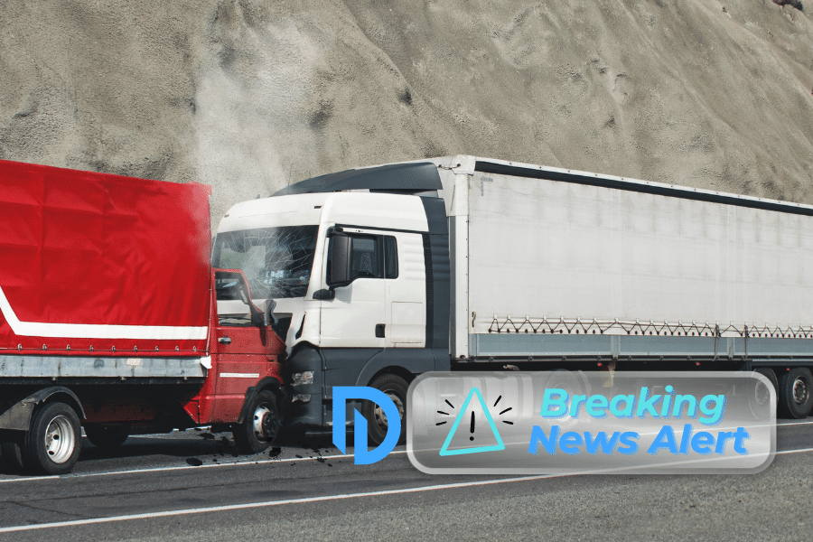 A white semi-truck crashed into the rear of a red truck trailer