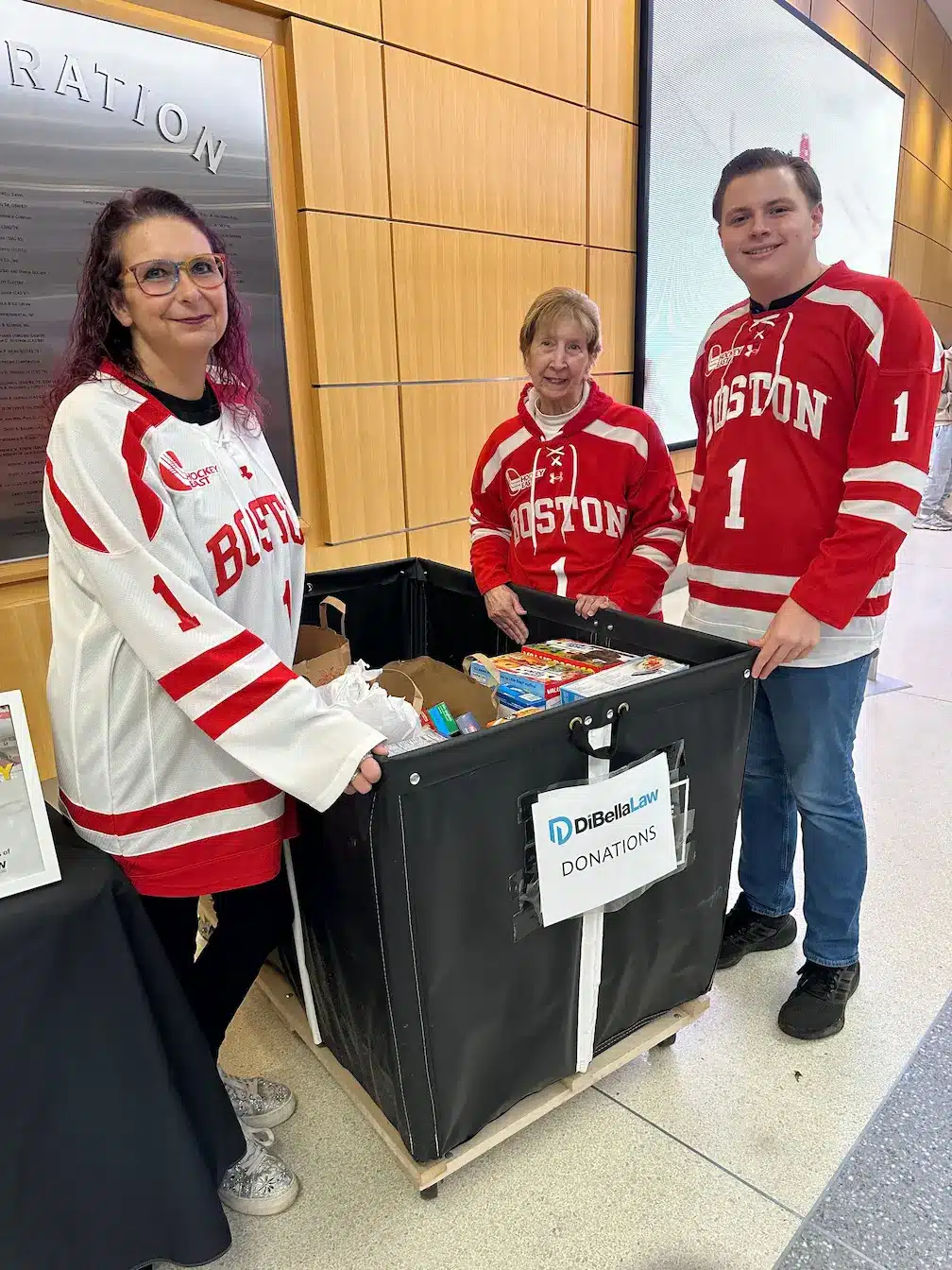 DiBella Law team donating at Food Drive Agganis