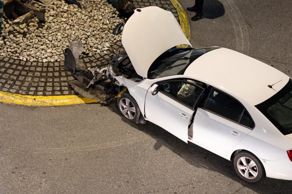 car-crash-scene-at-a-city-traffic-circle-at-night