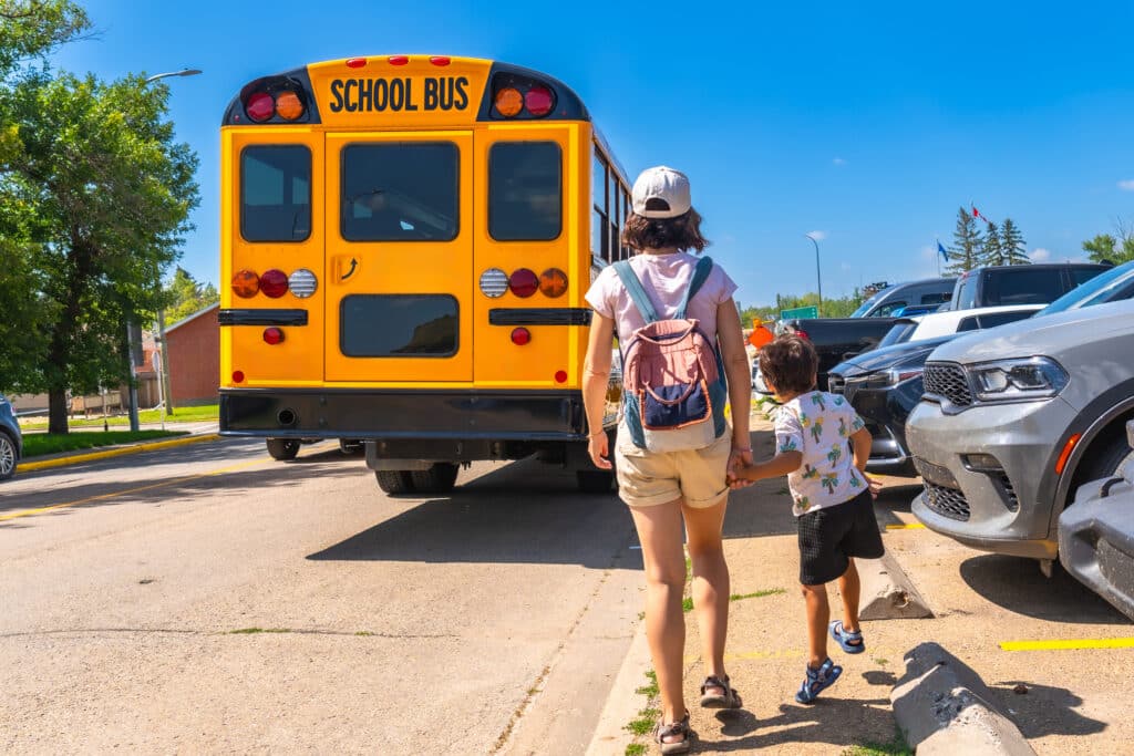 yellow bus and kids walking