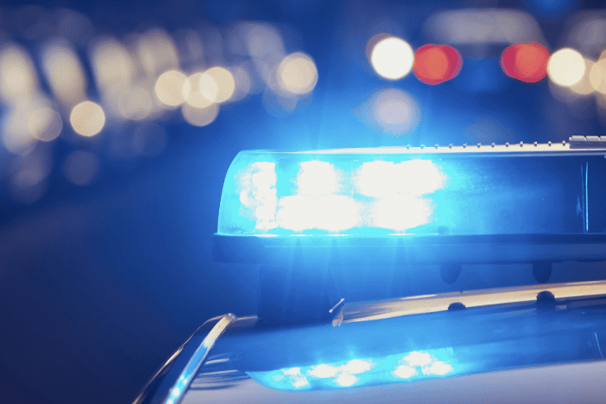 close up of the top of a boston police car at night. Sirens are blue