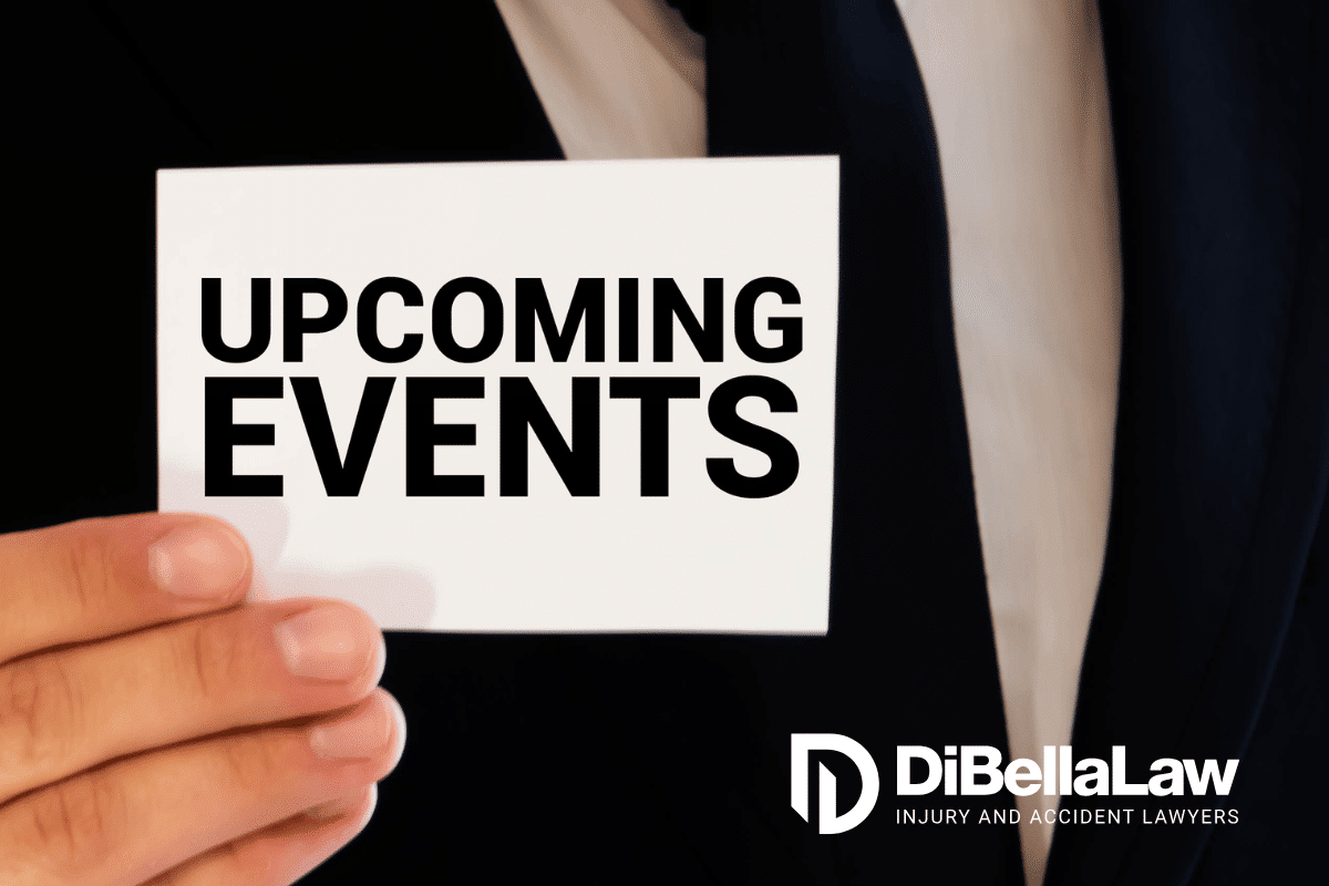 A man holding a piece of paper that says "upcoming events."